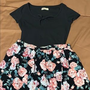 A bodysuit and skirt complex